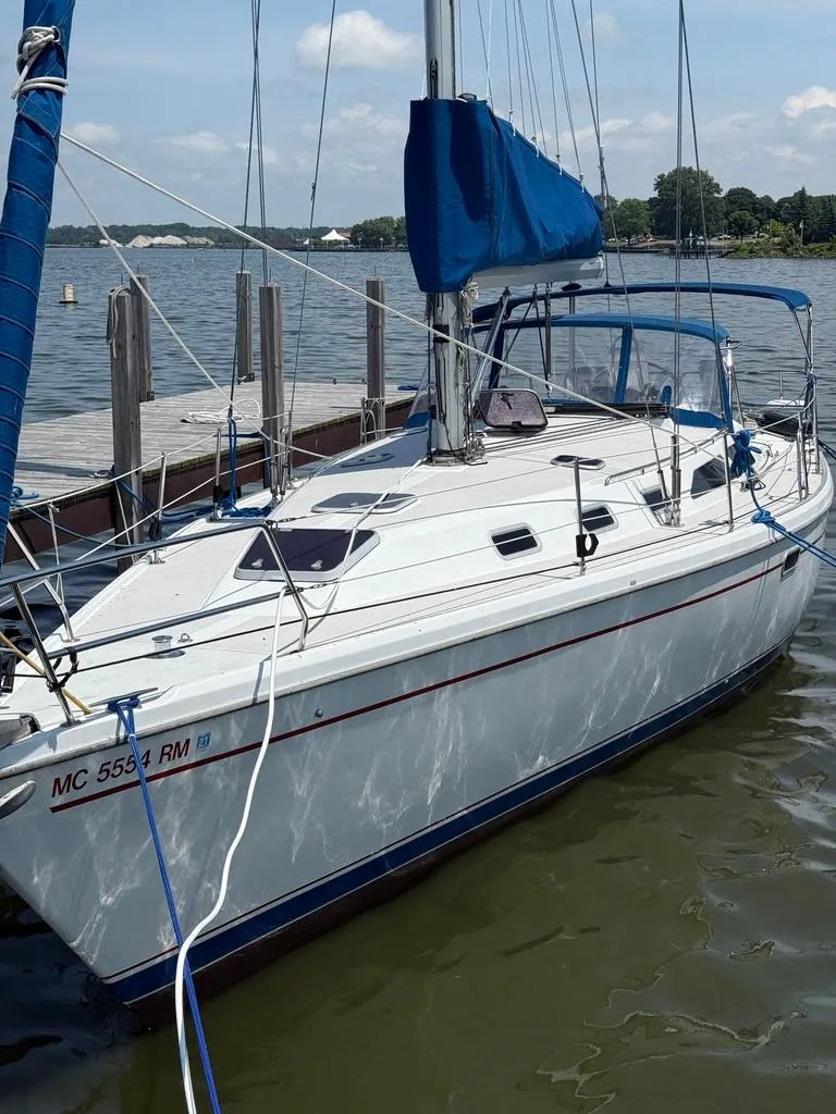 Slide: The Image of Sailboat Catalina 42Mk 2, 1998 model, docked at a marina on a sunny day. - 2