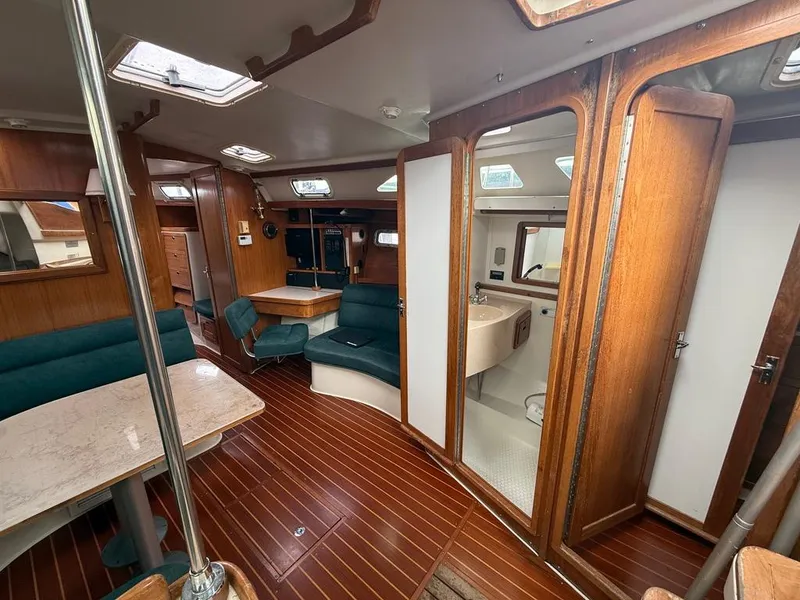 Slide: The Image of Interior of 1998 Catalina 42Mk 2 sailboat with wood finish and seating area. - 4