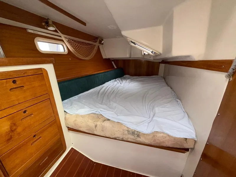 Slide: The Image of Cozy cabin interior of 1998 Catalina 42Mk 2 sailboat with wooden drawers and bed. - 6