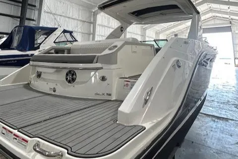 Slide: The Image of 2021 Sea Ray SLX 310 boat in a storage facility, rear view. - 17