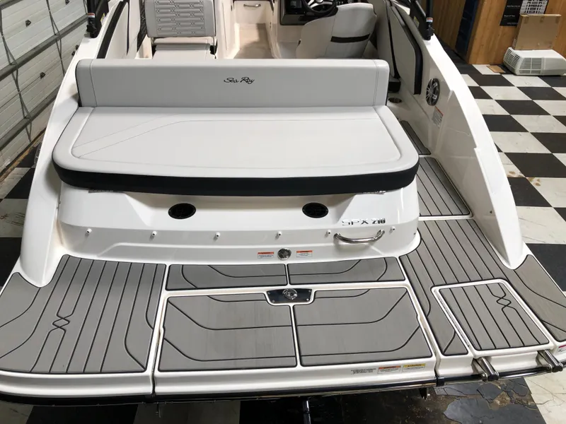 Slide: The Image of 2025 Sea Ray SPX 210 boat with sleek deck design and comfortable seating. - 3