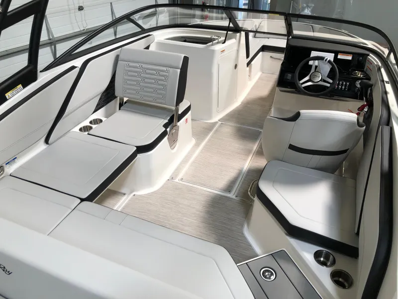 Slide: The Image of 2025 Sea Ray SPX 210 boat interior with modern seating and sleek design. - 6
