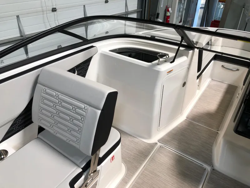 Slide: The Image of 2025 Sea Ray SPX 210 boat interior with sleek seating and modern design. - 7