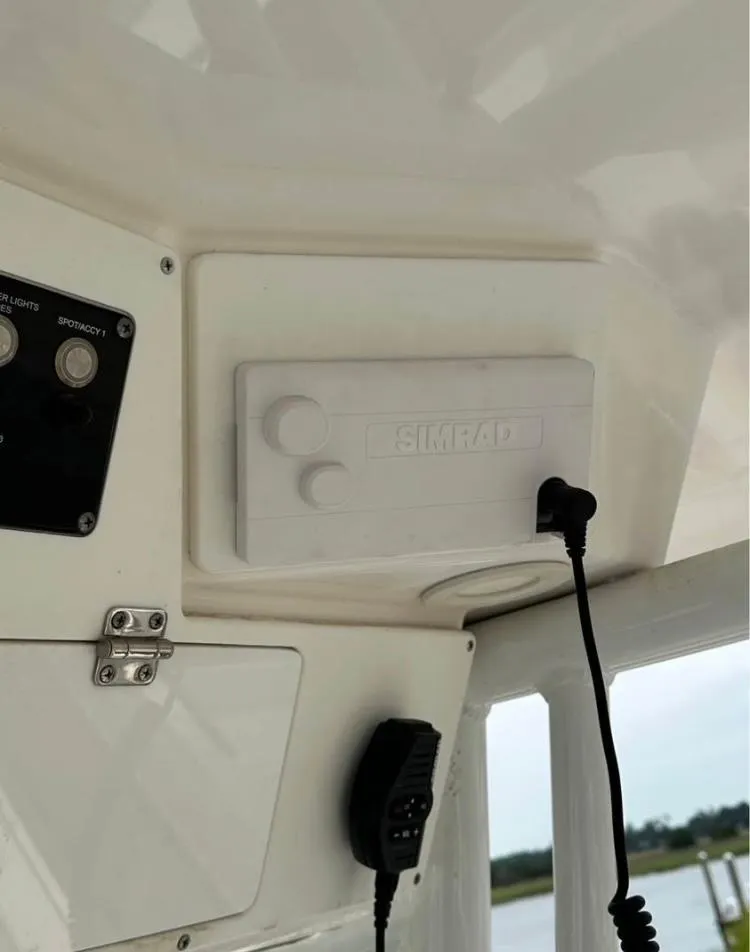 Slide: The Image of Control panel and Simrad device on 2021 Sea Fox 268 Commander boat. - 8