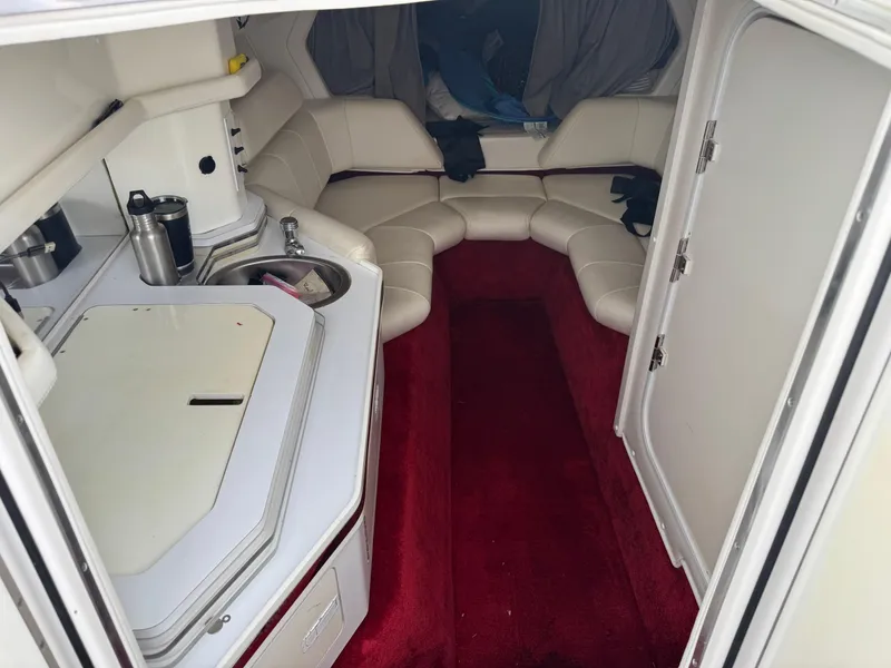 Slide: The Image of Interior of 2004 Fountain 35 Executioner boat with red carpet and white seating. - 11
