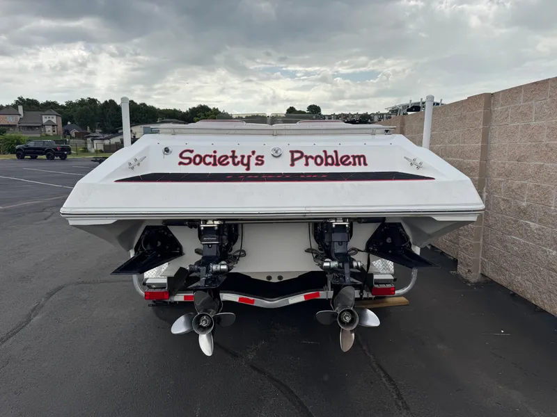 Slide: The Image of Rear view of 2004 Fountain 35 Executioner boat with "Society's Problem" text. - 3