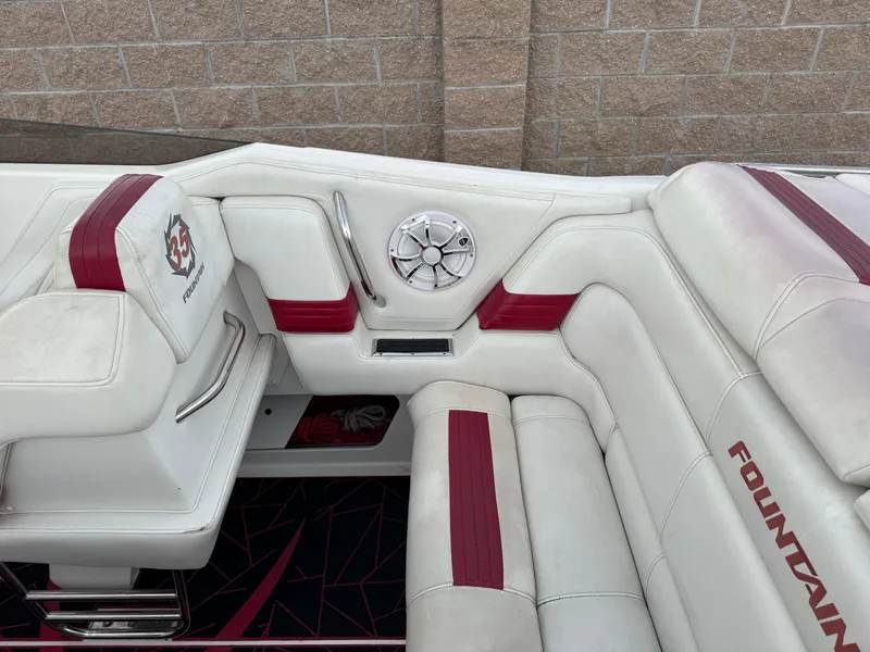 Slide: The Image of 2004 Fountain 35 Executioner boat interior with white and red seating. - 9