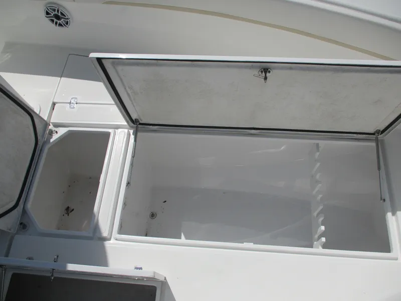 Slide: The Image of Open storage compartments on a 2024 Bluewater 2850 boat, showcasing spacious interior. - 13