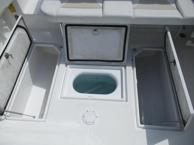 Slide: The Image of 2024 Bluewater 2850 boat storage compartments and livewell, open for viewing. - 15