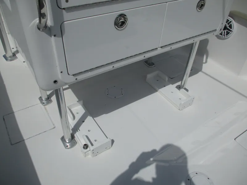 Slide: The Image of 2024 Bluewater 2850 boat deck with storage compartments and stainless steel supports. - 18