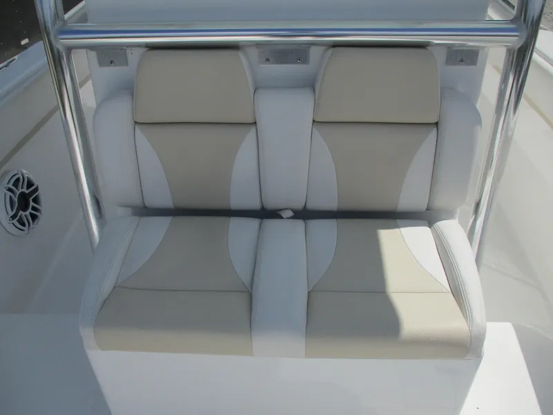 Slide: The Image of 2024 Bluewater 2850 boat seating with beige and white cushions, featuring stainless steel railings. - 21