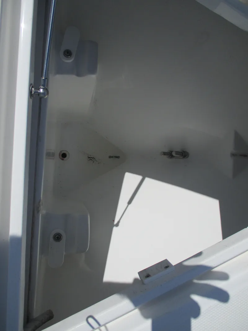 Slide: The Image of Open storage compartment of 2024 Bluewater 2850 boat, showing interior details. - 24