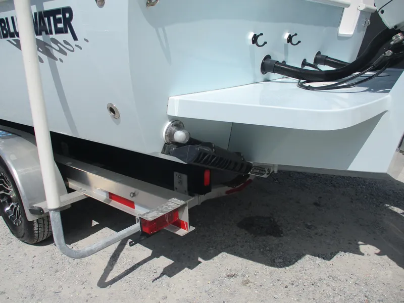 Slide: The Image of 2024 Bluewater 2850 boat on trailer, rear view showing hull and fittings. - 6