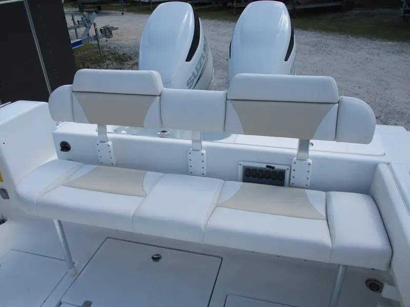 Slide: The Image of 2024 Bluewater 2850 boat with dual engines and cushioned seating. - 7