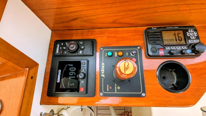 Slide: The Image of Control panel of a 2000 Hinckley Picnic Boat with navigation and communication equipment. - 5