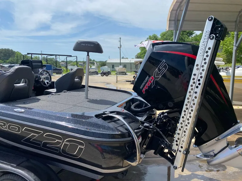 Slide: The Image of 2024 Nitro Z20 Pro boat with Mercury Pro XS engine, parked outdoors. - 2