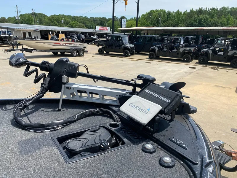 Slide: The Image of 2024 Nitro Z20 Pro boat with Garmin and Humminbird electronics at a dealership. - 4