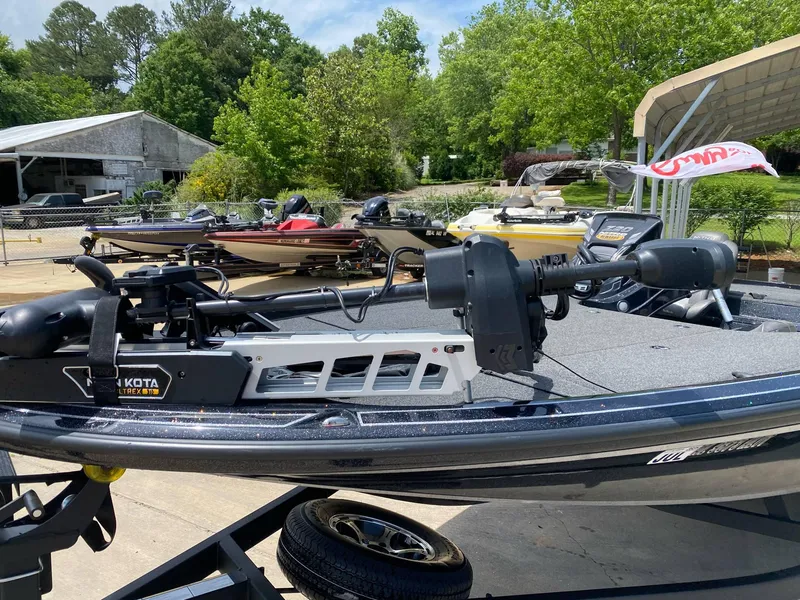 Slide: The Image of 2024 Nitro Z20 Pro boat with Minn Kota Ultrex motor, parked outdoors. - 7