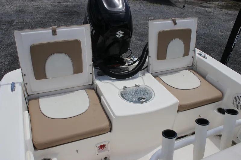 Slide: The Image of Sundance DX22 boat interior with seating and motor, 2022 model. - 18