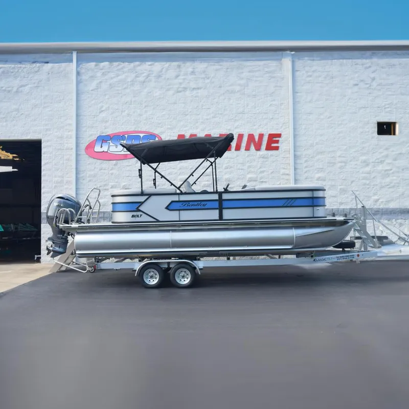 The Image of 2026 Bentley Pontoons Bolt on trailer outside marine dealership. - 0