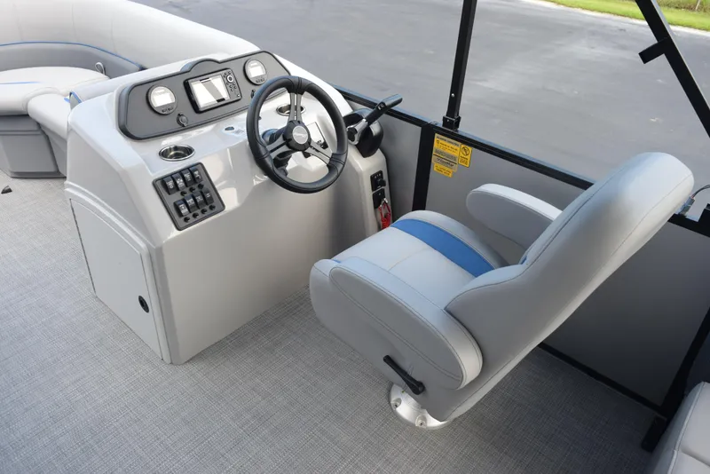 Slide: The Image of 2026 Bentley Pontoons Bolt interior with steering console and captain's chair. - 11