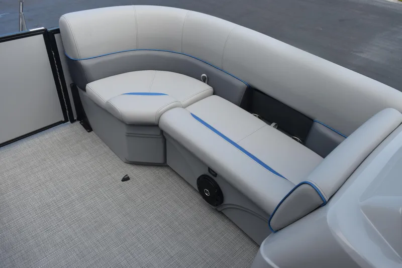 Slide: The Image of 2026 Bentley Pontoons Bolt interior with gray seating and blue accents. - 13