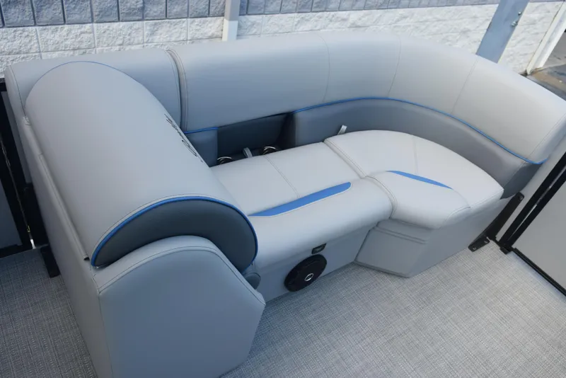 Slide: The Image of 2026 Bentley Pontoons Bolt interior seating with gray upholstery and blue accents. - 14