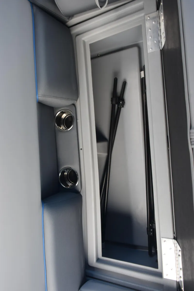 Slide: The Image of 2026 Bentley Pontoons Bolt storage compartment with sleek interior design and metallic accents. - 19