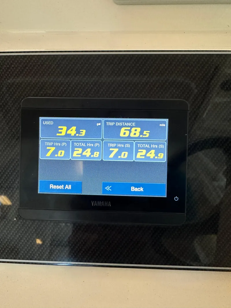 Slide: The Image of Yamaha display showing fuel usage and trip distance on 2024 Grady-White 232 Gulfstream. - 12