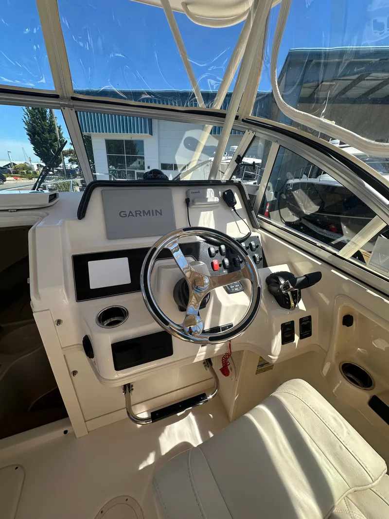 Slide: The Image of 2024 Grady-White 232 Gulfstream boat cockpit with Garmin navigation system. - 4