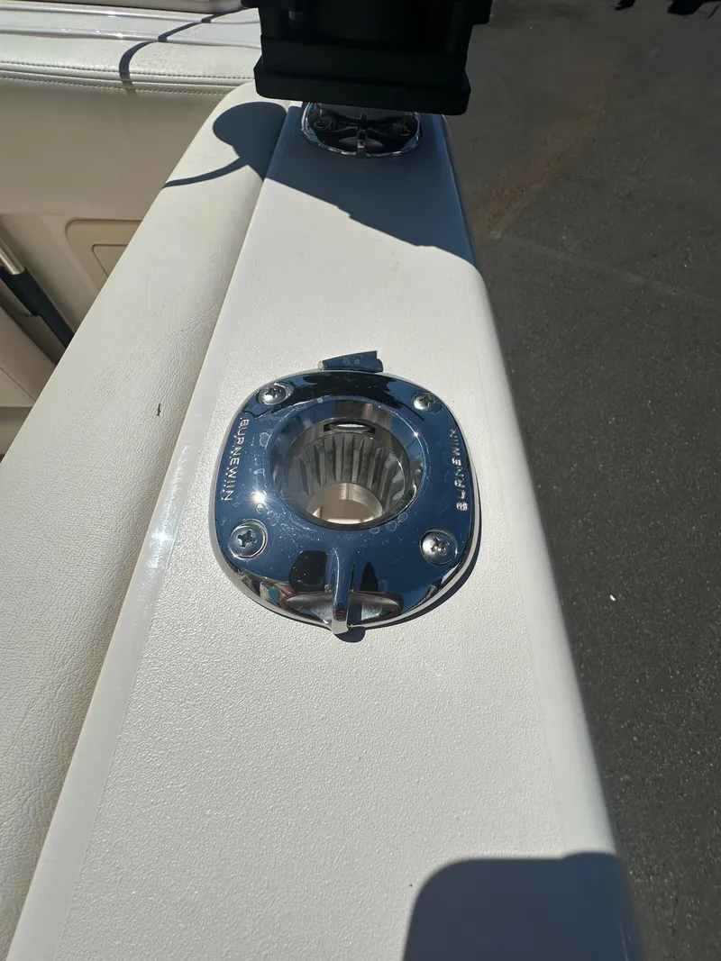 Slide: The Image of 2024 Grady-White 232 Gulfstream boat detail showing a stainless steel rod holder. - 7