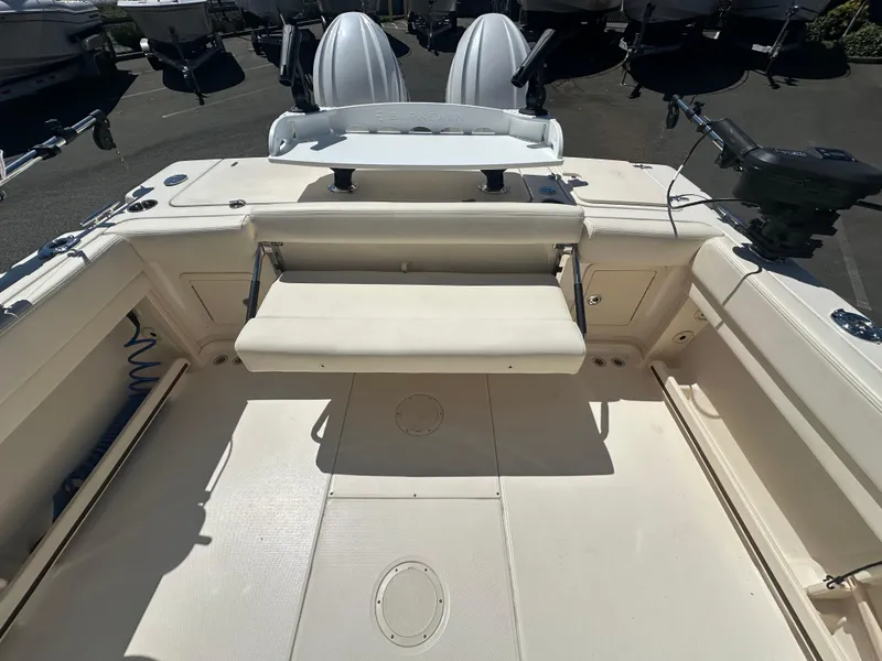 Slide: The Image of 2024 Grady-White 232 Gulfstream boat interior with seating and fishing equipment. - 8