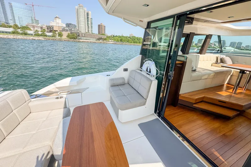 Slide: The Image of Luxurious 2017 Tiara Yachts C44 Coupe with elegant interior and waterfront city view. - 43