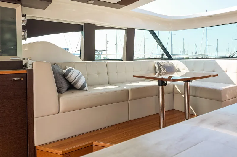 Slide: The Image of Luxurious interior of 2017 Tiara Yachts C44 Coupe with elegant seating and table. - 47