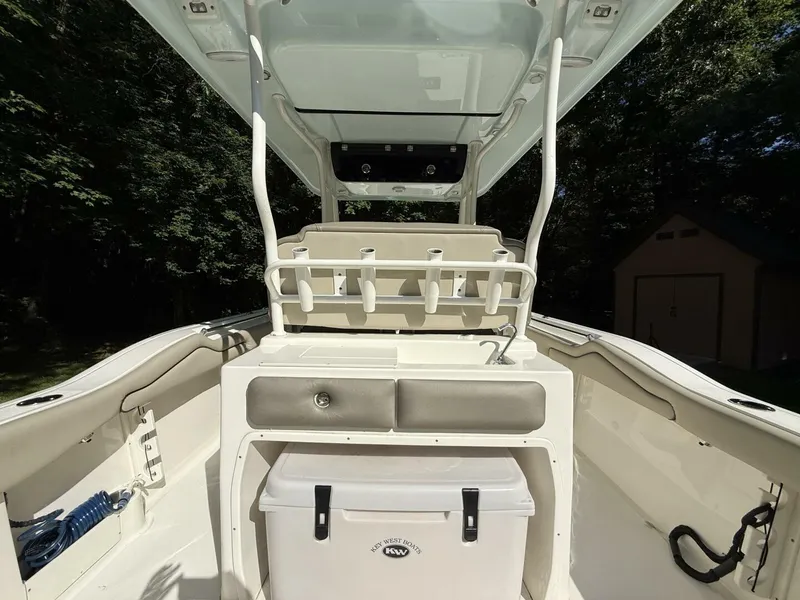 Slide: The Image of 2023 Key West 263 FS boat interior with storage and seating features. - 16