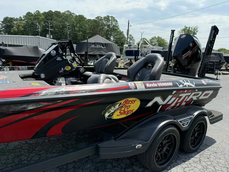 Slide: The Image of 2023 Nitro Z21 XL Pro bass boat with custom decals and sleek design. - 1