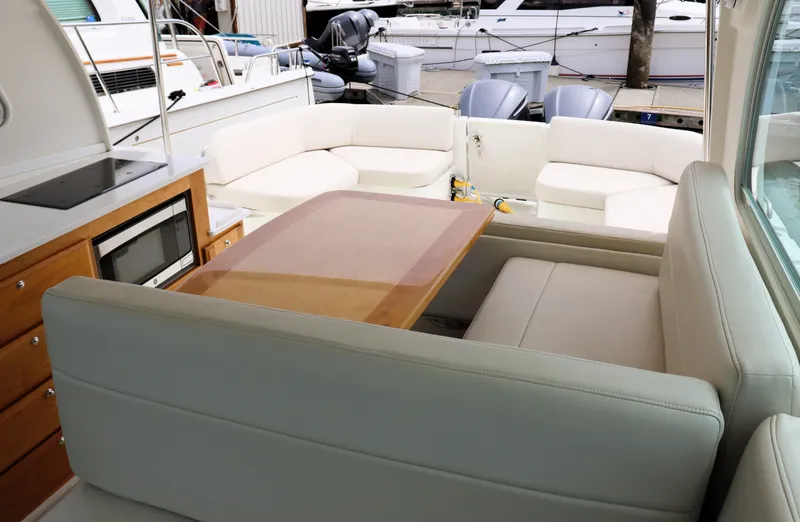 Slide: The Image of Luxurious interior of 2020 Back Cove 34O yacht with seating and dining area. - 15