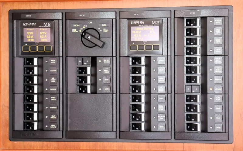 Slide: The Image of Electrical control panel on a 2020 Back Cove 34O boat, featuring Blue Sea Systems components. - 28