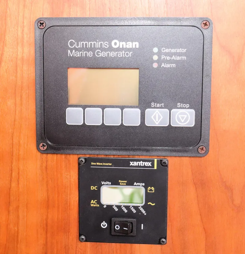 Slide: The Image of Control panels for Cummins Onan marine generator and Xantrex inverter on a 2020 Back Cove 34O. - 29