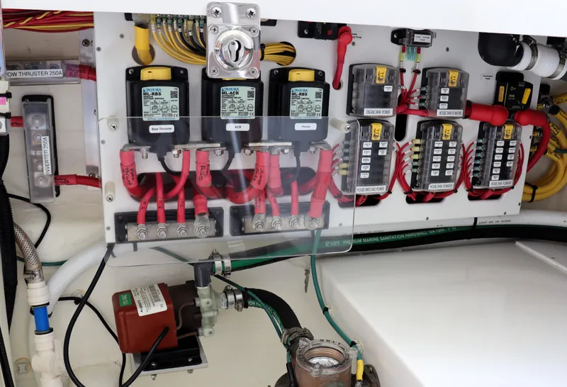 Slide: The Image of Electrical panel of a 2020 Back Cove 34O boat, showcasing wiring and components. - 32