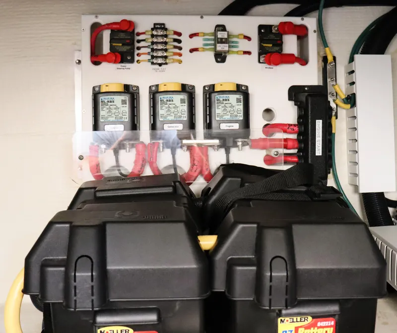 Slide: The Image of Electrical panel and battery setup in a 2020 Back Cove 34O boat. - 35