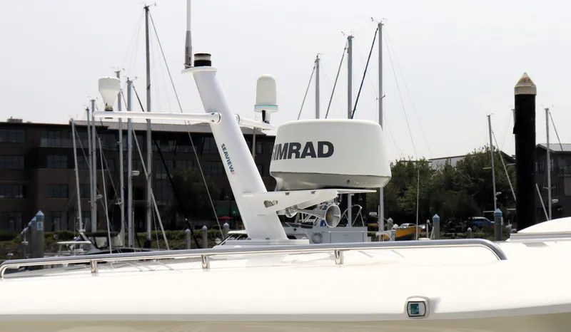 Slide: The Image of 2020 Back Cove 34O boat radar system at marina, featuring Simrad equipment. - 37