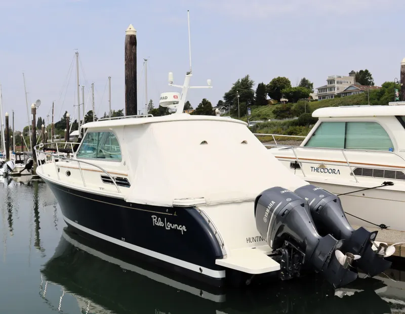 Slide: The Image of 2020 Back Cove 34O boat docked with twin Yamaha outboard engines. - 6