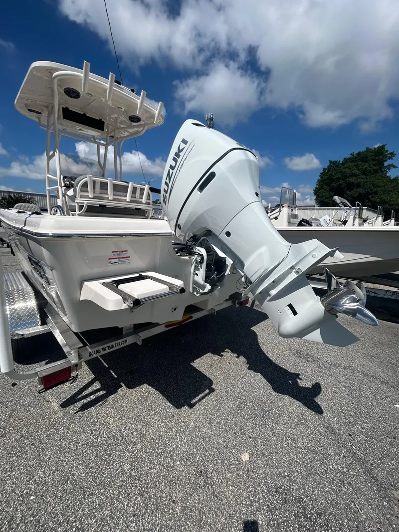 Slide: The Image of 2025 Carolina Skiff 21 Ultra Elite boat with Suzuki outboard motor on trailer. - 11