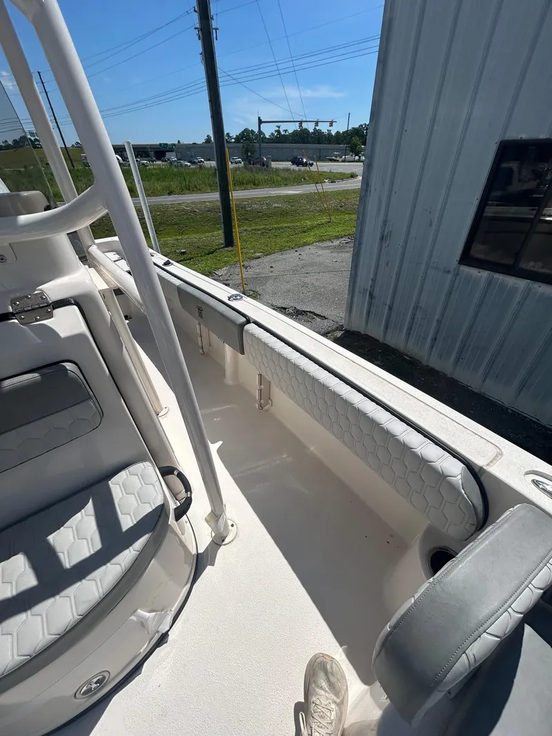 Slide: The Image of 2025 Carolina Skiff 21 Ultra Elite boat interior with cushioned seating and sleek design. - 4