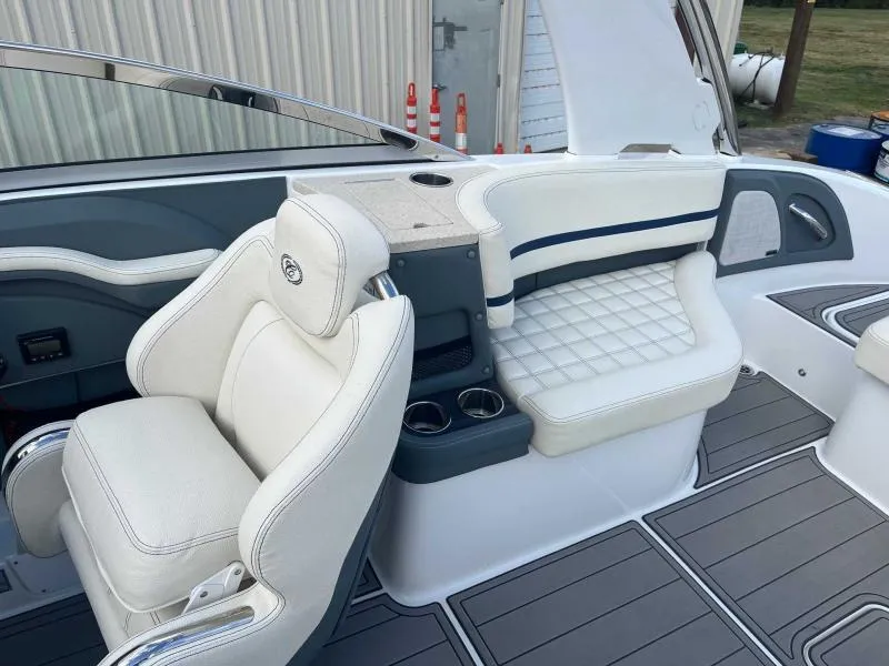 Slide: The Image of 2021 Cobalt R7 boat interior with white leather seating and cup holders. - 11
