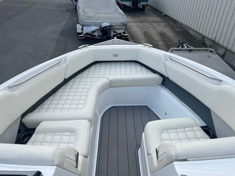 Slide: The Image of 2021 Cobalt R7 boat with white cushioned seating and sleek design. - 12