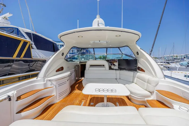 Slide: The Image of Luxurious 2000 Sea Ray 510 Sundancer yacht interior with white seating and wooden flooring. - 18