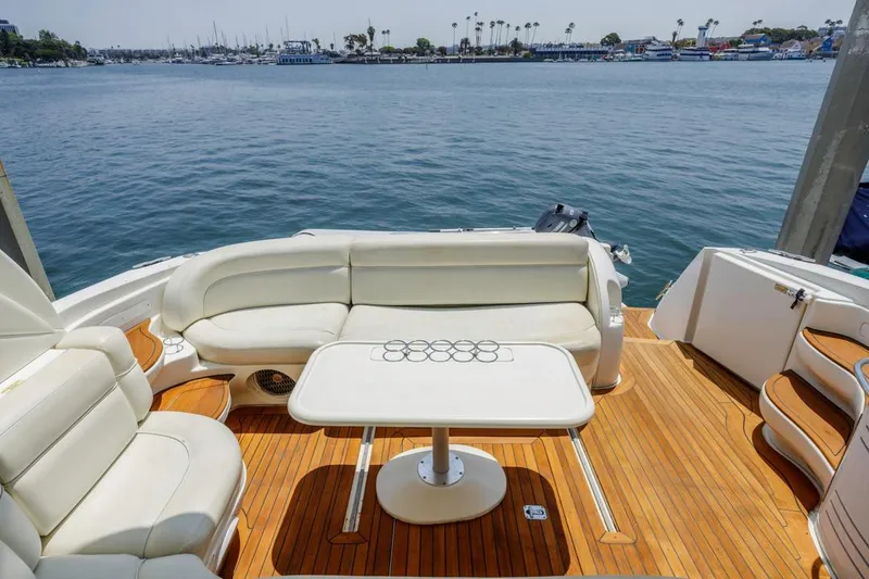 Slide: The Image of Luxurious 2000 Sea Ray 510 Sundancer yacht with elegant seating and scenic ocean view. - 25