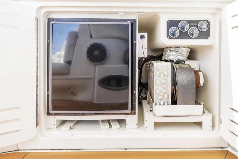 Slide: The Image of Engine compartment of a 2000 Sea Ray 510 Sundancer boat, showing mechanical components. - 27